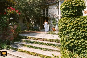   In Cape Elizabeth, Maine, the bride lifts her dress as she approaches the groom blending excitement with a touch of playful elegance.